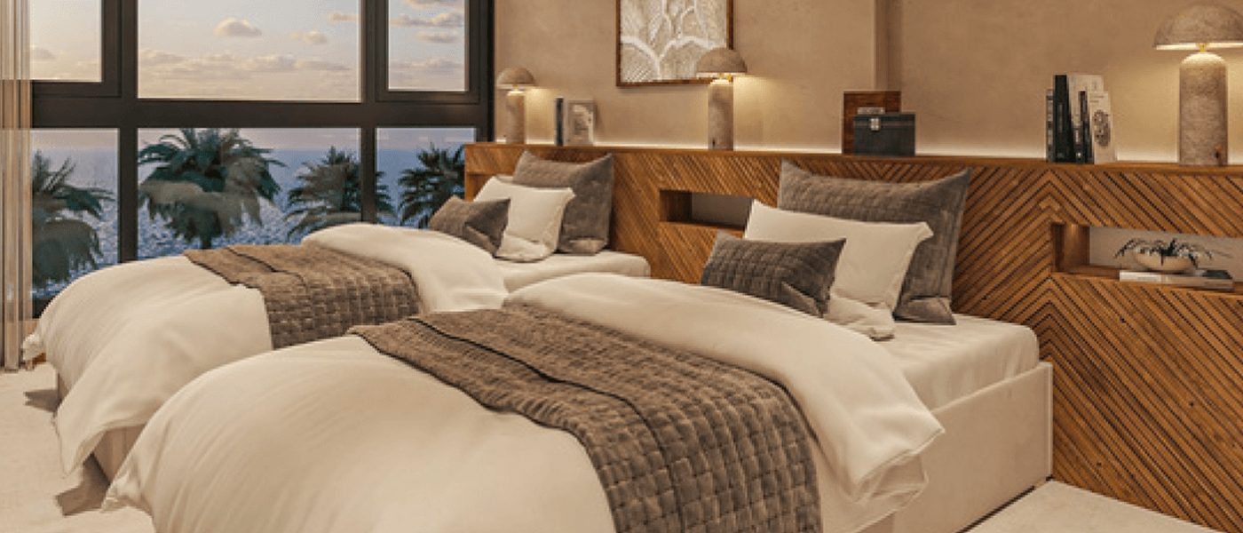 Two-bedroom second bedroom with twin beds and ocean views